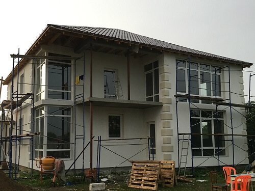 Отделка фасада дома штукатуркой в Воложине